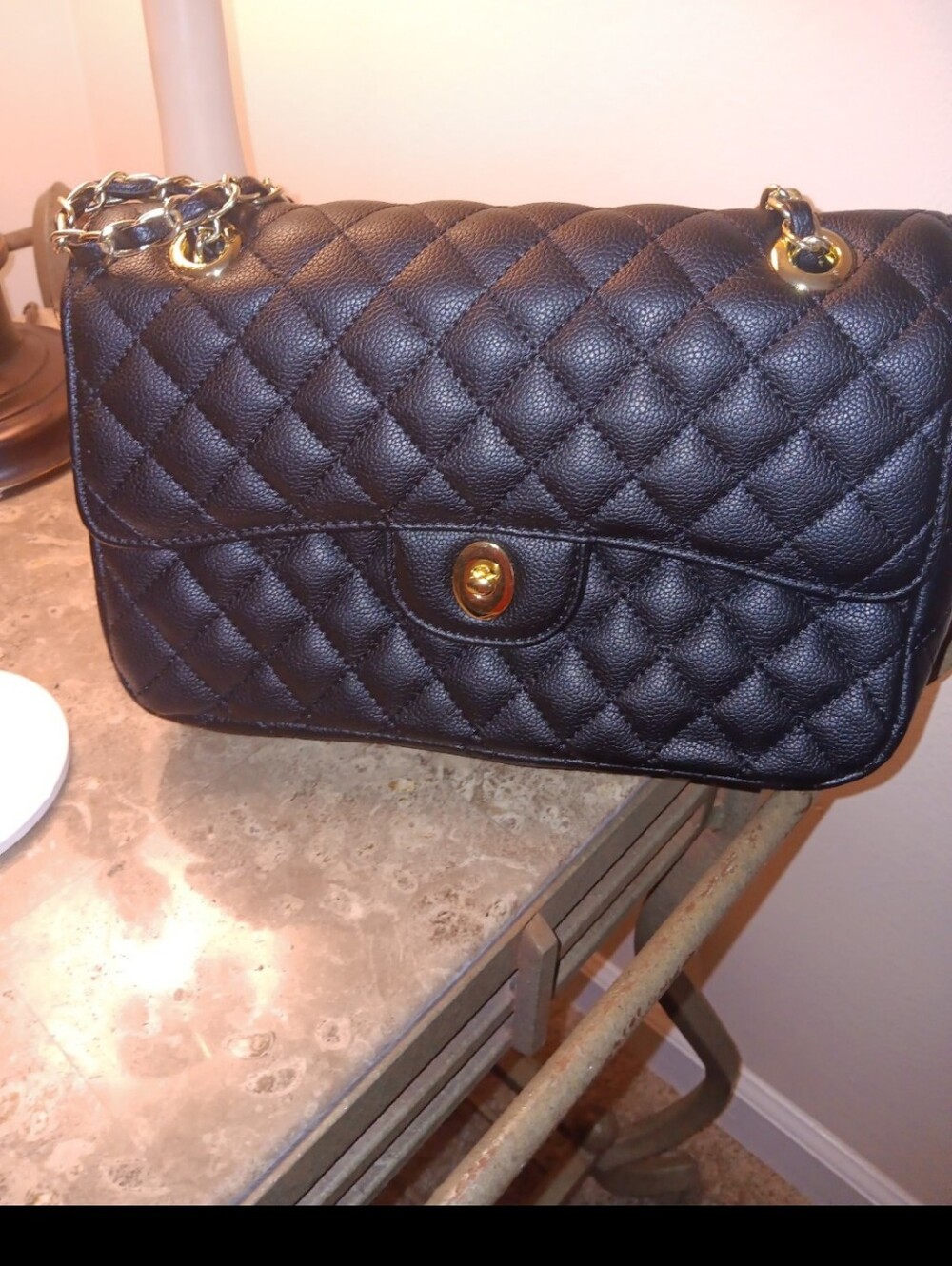 Black quited latch purse
